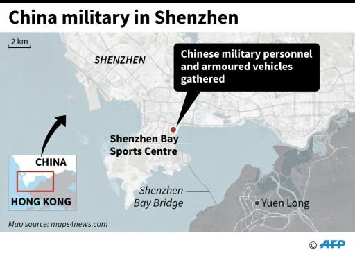 Map showing a stadium in the southern Chinese city of Shenzhen where thousands of military personnel and armoured vehicles were seen gathered on Thursday