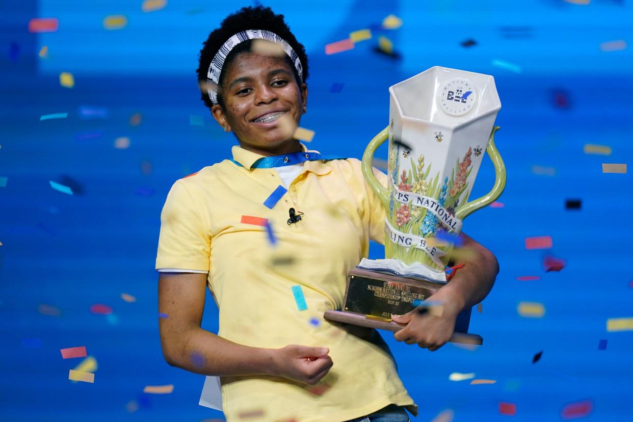 Zaila Avant-garde, 14, from Harvey, Louisiana celebrates with the championship trophy after winning the finals of the 2021 Scripps National Spelling Bee at Disney World Thursday, July 8, 2021, in Lake Buena Vista, Fla.