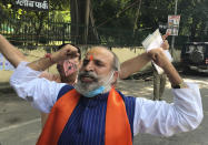 Jai Bhagwan Goyal, a leader of India's ruling Bharatiya Janata Party and an accused in the 1992 attack and demolition of a 16th century mosque, celebrates outside a court in Lucknow, India, Wednesday, Sept. 30, 2020. An Indian court on Wednesday acquitted all 32 accused, including senior leaders of the ruling Hindu nationalist Bharatiya Janata Party, in the case. The demolition sparked Hindu-Muslim violence that left some 2,000 people dead. (AP Photo/Rajesh Kumar Singh)