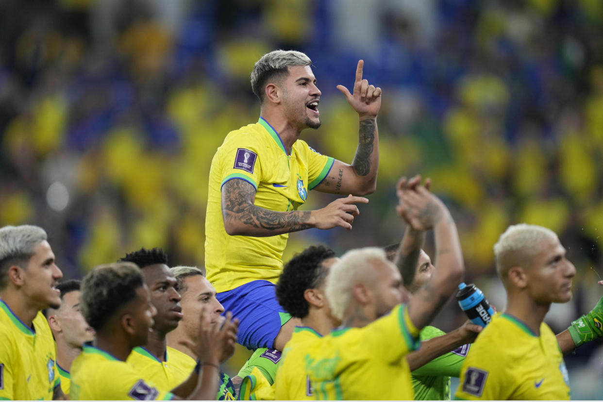 Brazil's players celebrate at the end of the World Cup round of 16 soccer match between Brazil and South Korea, at the Stadium 974 in Doha, Qatar, Monday, Dec. 5, 2022. (AP Photo/Andre Penner)