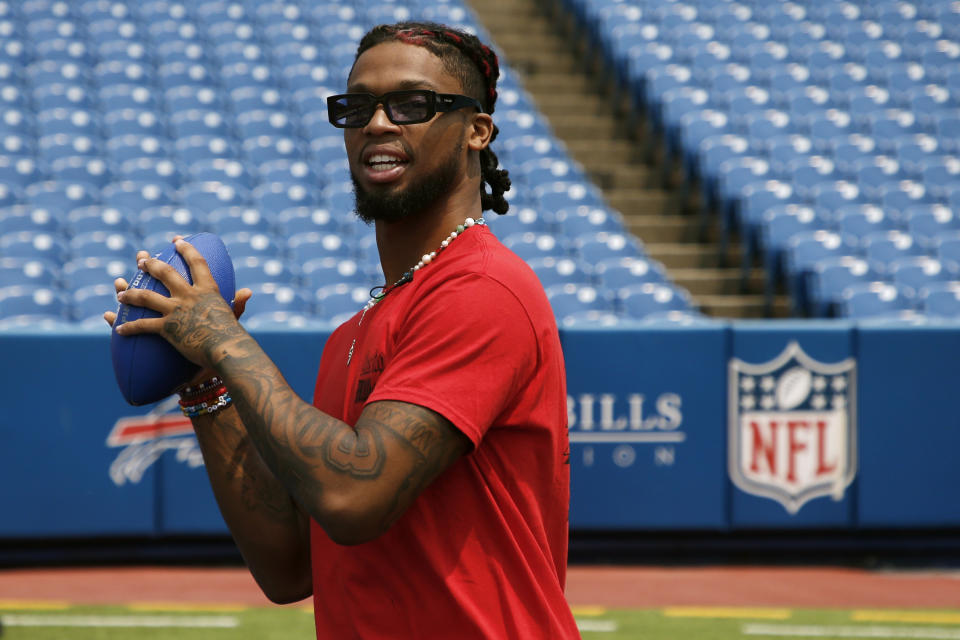 Buffalo Bills defensive back Damar Hamlin throws a pass following the announcement of his Chasing M's Foundation CPR Tour, Saturday, June 3, 2023, in Orchard Park, N.Y. Hamlin is starting to use some of the massive influx of money his Chasing M's Foundation received in the aftermath of his near-death experience in January for underprivileged children in his hometown of Pittsburgh. (AP Photo/Jeffrey T. Barnes, File)