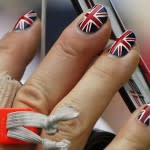Britain's Alison Williamson sports fingernails painted in the colors of the Union Jack during the women's archery individual ranking round of the London 2012 Olympics Games at the Lords Cricket Ground in London