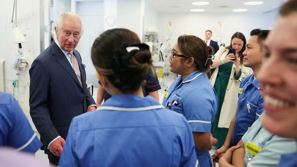 Charles looked delighted to be out and about once more, stopping repeatedly during his hospital walkabout to chat with patients as well as the staff who had gathered in the hopes of seeing the royal. - Suzanne Plunkett/Reuters