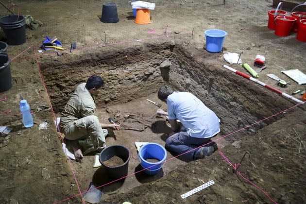 Dr Tim Maloney and Andika Priyatno work at the site in a cave in East Kalimantan, Borneo, Indonesia on March 2, 2020. (Photo: Tim Maloney/Griffith University via AP)