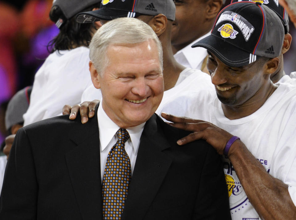 FILE - Los Angeles Lakers' Kobe Bryant gives basketball great Jerry West a shoulder rub after the Lakers beat the San Antonio Spurs in Game 5 of the NBA Western Conference basketball finals in Los Angeles, May 29, 2008. Jerry West, who was selected to the Basketball Hall of Fame three times in a legendary career as a player and executive and whose silhouette is considered to be the basis of the NBA logo, died Wednesday morning, June 12, 2024, the Los Angeles Clippers announced. He was 86. (AP Photo/Kevork Djansezian, File)