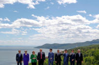 European Council President Donald Tusk, Britain's Prime Minister Theresa May, Germany's Chancellor Angela Merkel, U.S. President Donald Trump, Canada's Prime Minister Justin Trudeau, France's President Emmanuel Macron, Japan's Prime Minister Shinzo Abe, Italy's Prime Minister Giuseppe Conte and European Commission President Jean-Claude Juncker pose for a family photo at the G7 Summit in the Charlevoix city of La Malbaie, Quebec, Canada, June 8, 2018. REUTERS/Yves Herman