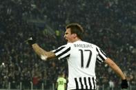 Juventus' forward Mario Mandzukic celebrates after scoring during a UEFA Champions League football match against Manchester City on November 25, 2015 at the Juventus Stadium in Turin