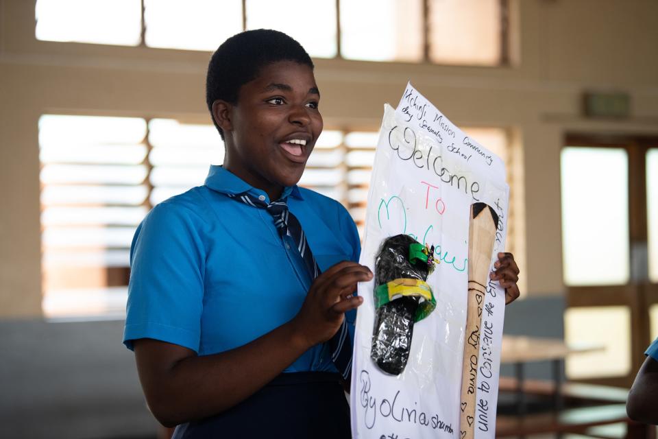 17-year-old Olivia Shumba presenting to Clooney, Gates, Obama and other visitors at Ludzi Girls’ Secondary School.