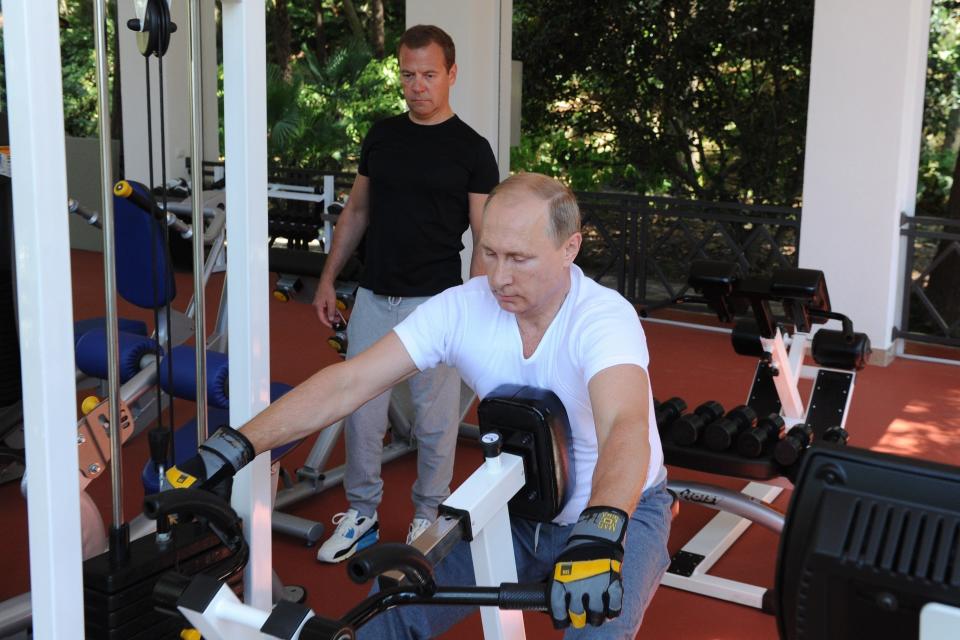 Putin and Russian Prime Minister Dmitry Medvedev fit in a work out at the Bocharov Ruchei state residence in Sochi, Russia, on Aug. 30, 2015.