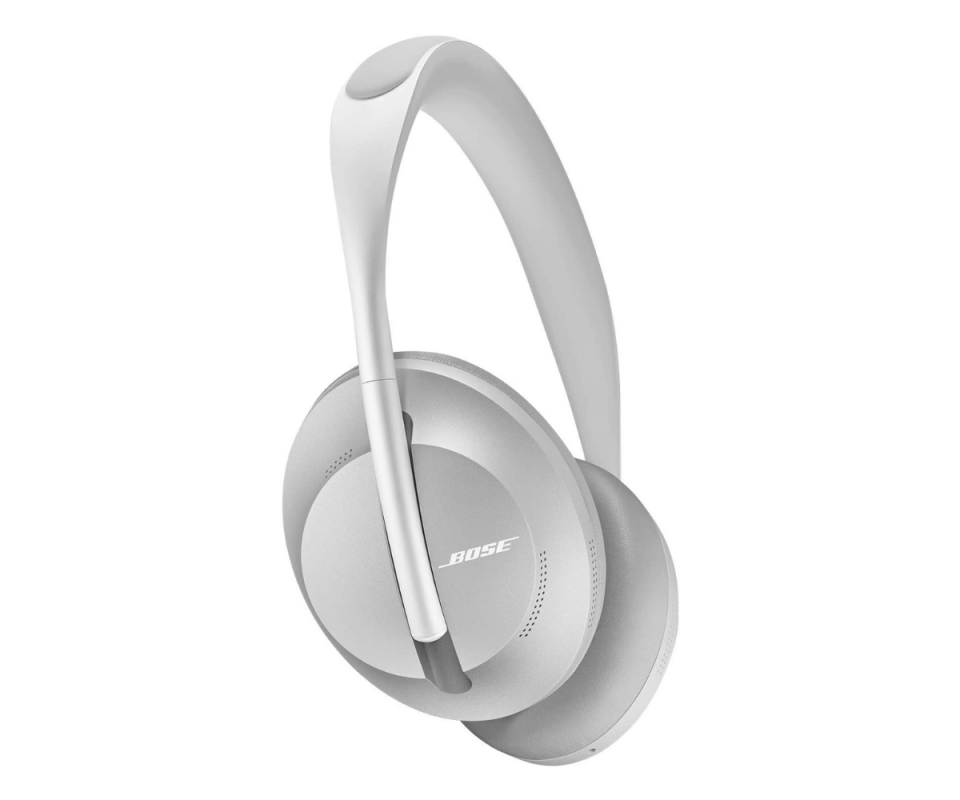 Bose silver over-ear headphones infront of a white background.