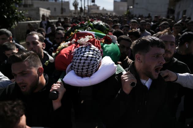 Relatives mourn 17-year-old American Tawfiq Ajaq at his funeral in his family’s Palestinian home village in Al-Mazra'a ash-Sharqiya, occupied West Bank, on Saturday. Ajaq was killed Friday by Israeli fire and police say they have launched an investigation.