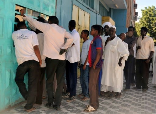 Queuing has become a way of life in Sudan -- at bakeries, petrol stations and ATM machines -- as a collapse in hard currency earnings has led to chronic shortages of cash and basic goods