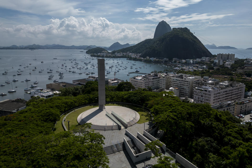 A monument stands outside the Holocaust Victims Memorial on the first day it opened to the public, with a Sugar Loaf Mountain in the background, in Rio de Janeiro, Brazil, Thursday, Jan. 19, 2023. The museum tells the stories of the thousands of people who took refuge in Brazil during the Holocaust. (AP Photo/Bruna Prado)