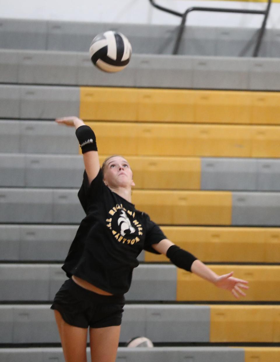 Gwyneth Harper serves during practice at Richmond Hill High School on Monday, August 28, 2023.