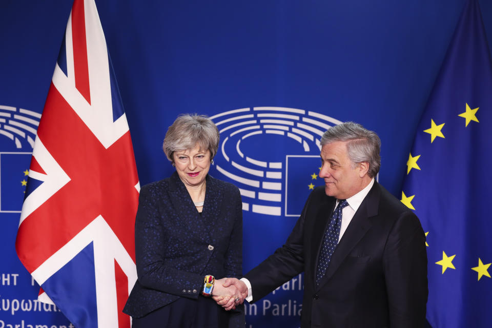 European Parliament President Antonio Tajani, right, shakes hands with British Prime Minister Theresa May before their talks at the European Parliament in Brussels, Thursday, Feb. 7, 2019. (AP Photo/Francisco Seco)