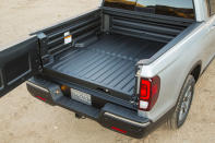 <p>The tailgate swings or drops down in classic station-wagon style.</p>