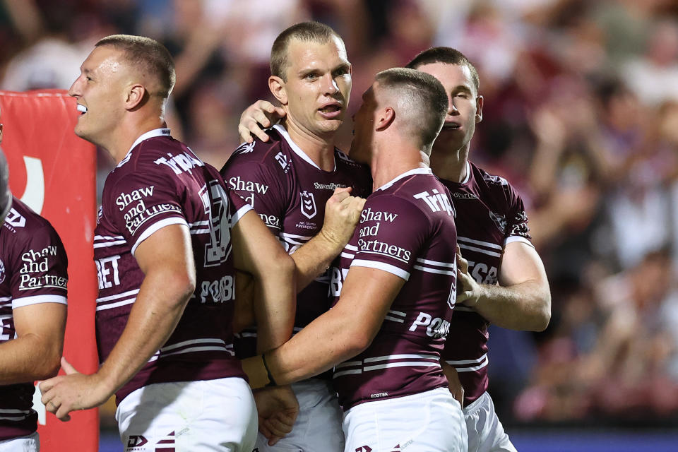 Tom Trbojevic celebrates with his teammates.