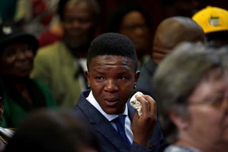 Victor Mlotshwa reacts after farmers Willem Oosthuizen and Theo Martins were sentenced for kidnap, assault and attempted murder, in connection with forcing Mlotshwa into a coffin, in Middelburg, South Africa, October 27, 2017. REUTERS/Siphiwe Sibeko