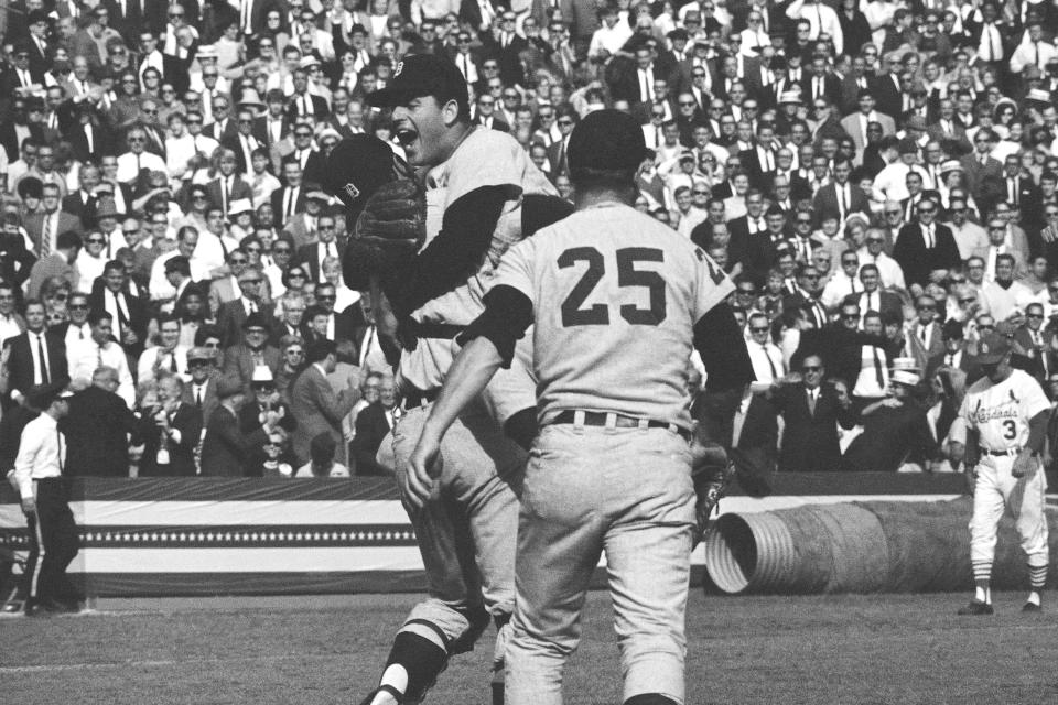 FILE - Detroit Tigers catcher Bill Freehan lifts pitcher Mickey Lolich off his feet as he screams with joy after defeating the St. Louis Cardinals 4-1 in the final game of the World Series in St. Louis, in this Thursday, Oct. 11, 1968, file photo. Joining the celebration is Norm Cash (25). Freehan, an 11-time All-Star catcher with the Detroit Tigers and key player on the 1968 World Series championship team, has died at age 79. “It’s with a heavy heart that all of us with the Detroit Tigers extend our condolences to the friends and family of Bill Freehan,” the team said Thursday, Aug. 19, 2021. (AP Photo)