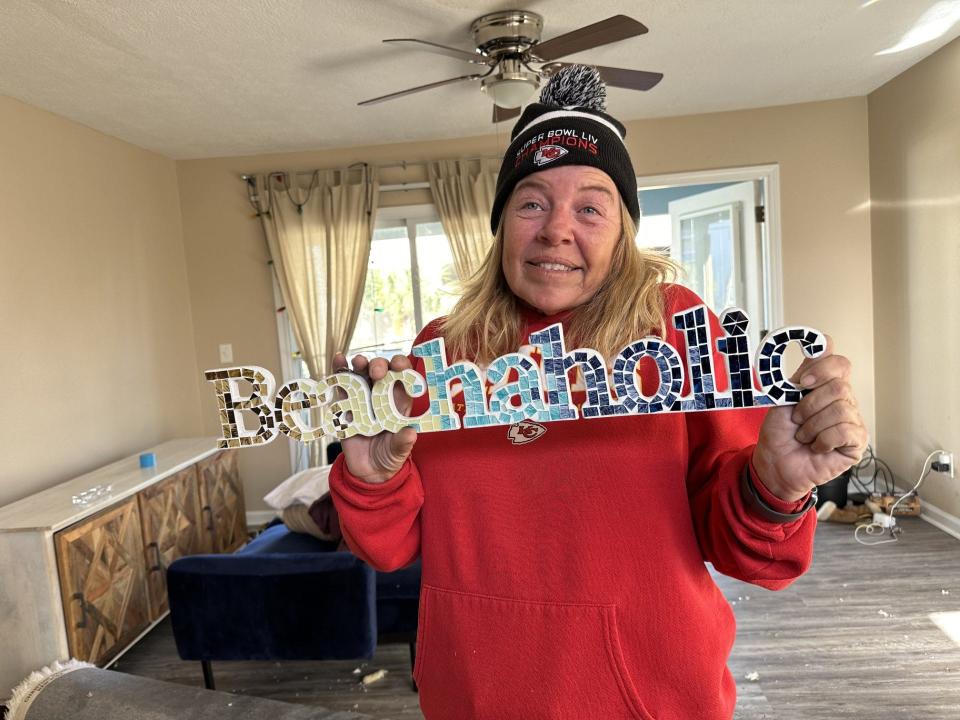 TJ Evans loves the beach and was able to salvage this sign from her unit.