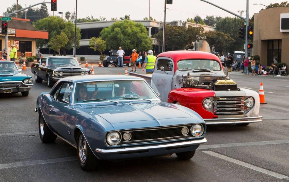 Vintage cars line the streets of downtown Modesto for the 2021 North Modesto Kiwanis Club American Graffiti parade.