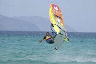 <p>French windsurfer Antone Albeau competes in the slalom race during the Windsurf World Championship in Sotavento beach, southern Fuerteventura, Canary Islands, southwestern Spain, July 30, 2016. Albeau has won the title of World Windsurf Slalom Champion 23 times. (Photo: Carlos de Saa/Reuters) </p>