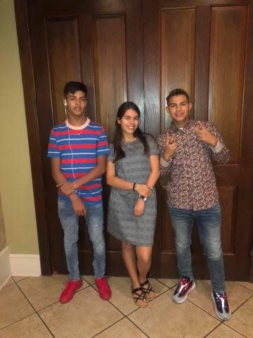 Sean Yadriel Burgos-Jimenez is seen with his two siblings. Burgos-Jimenez was shot and killed in the parking lot of the Fort Walton Beach Recreation Center on July 7.