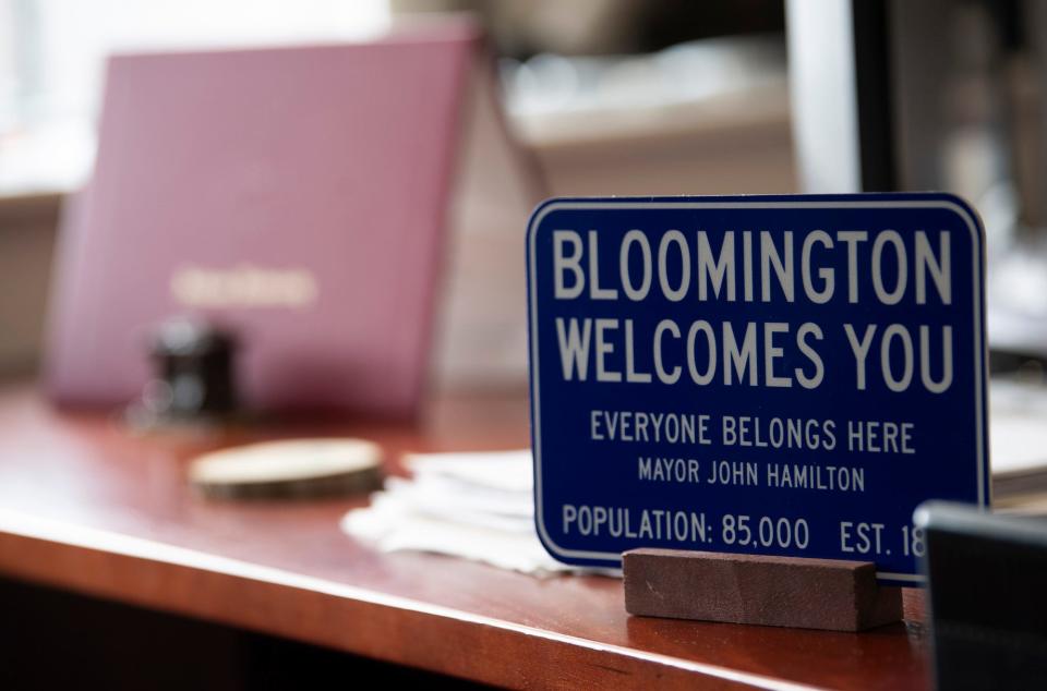 A sign on Mayor John Hamilton's desk reads "Bloomington Welcomes You." Hamilton had hoped the population of the city would grow through annexation during his time in office, but the effort is tied up in court.