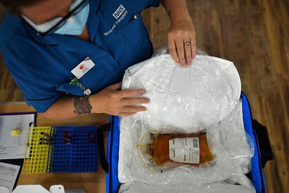 Blood plasma is prepared for delivery at a newly opened plasma donor centre in Twickenham, southwest London (AFP via Getty Images)