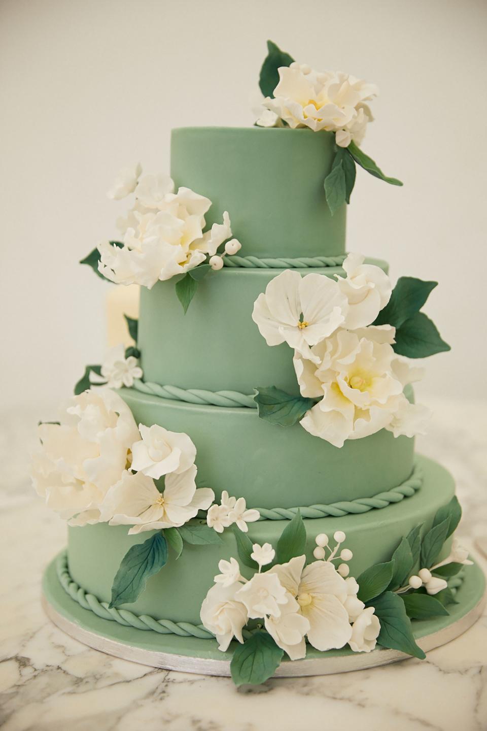 The white chocolate and raspberry four-tiered cake was made by a friend, and the iced sugar flowers were a mixture of peonies and blossoms from my chosen de Gournay design. It was delicious.