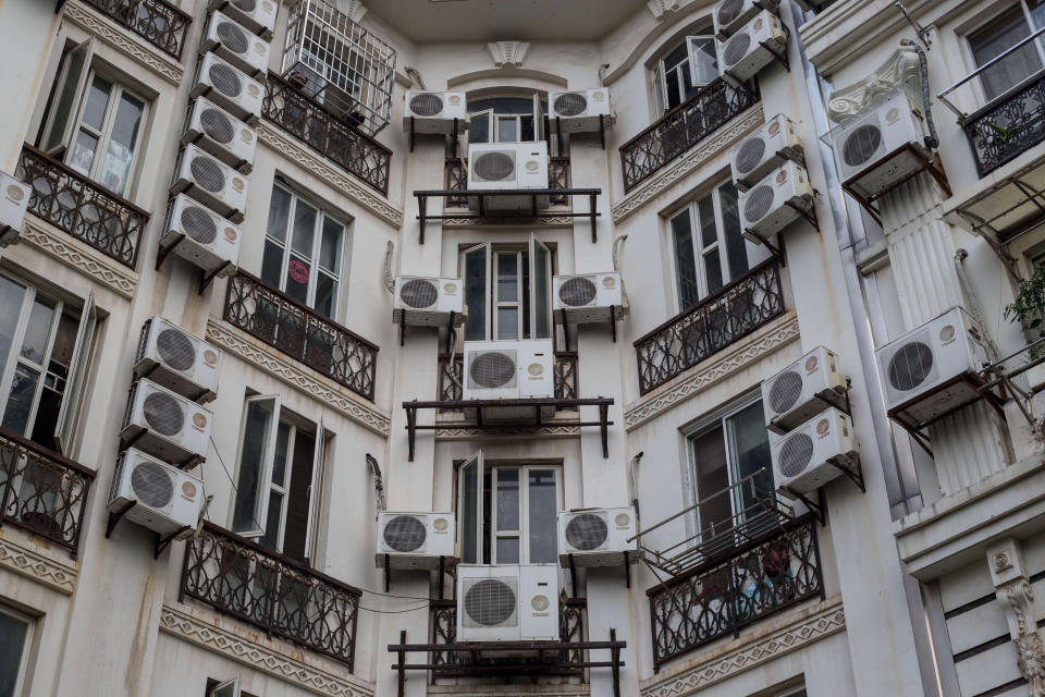 Apartment buildings are covered with air conditioning units in Tianducheng, a residential community in Zhejiang Province, China. (Photo: Guillaume Payen via Getty Images)