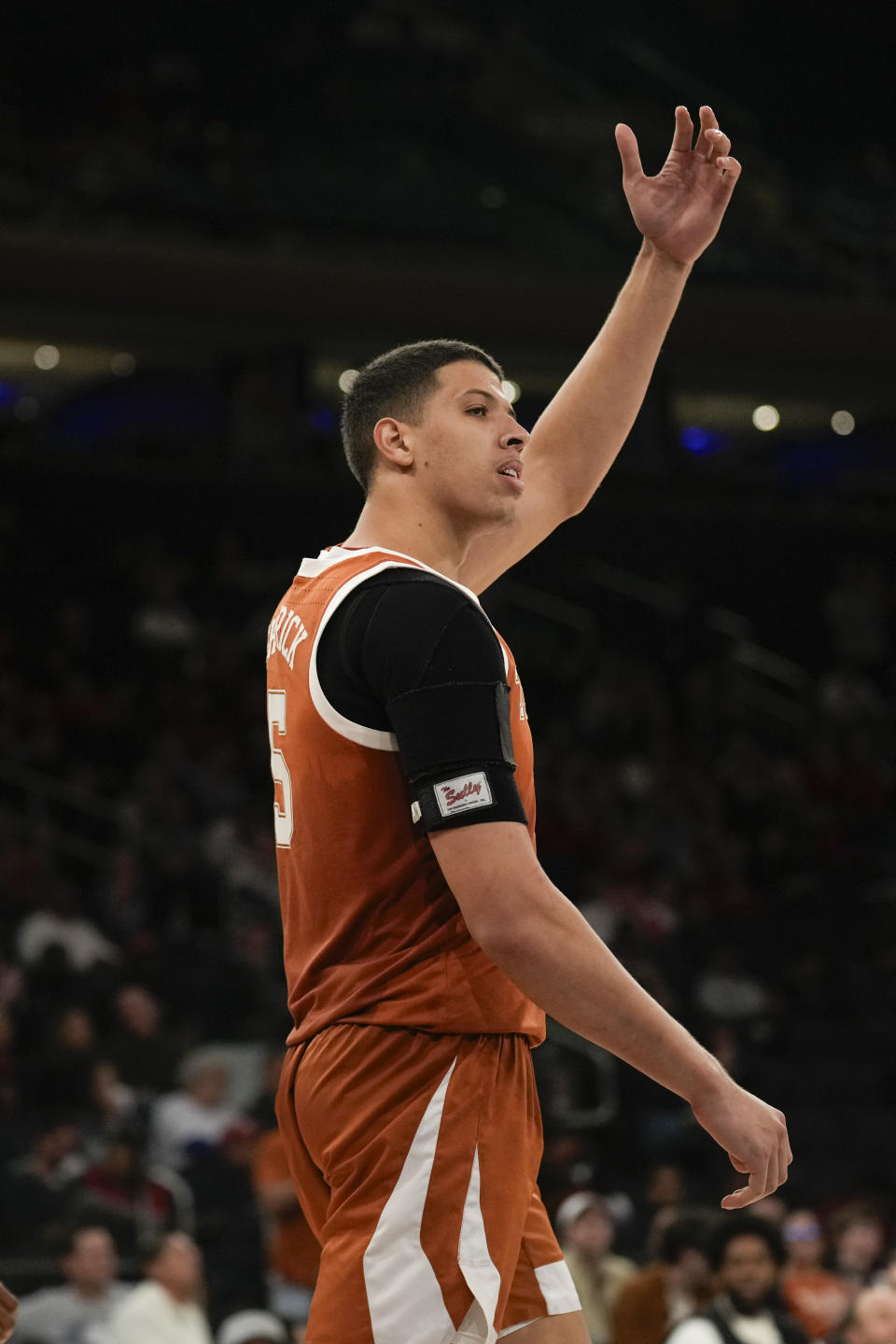 Texas's Kadin Shedrick celebrates after dunking the ball during the second half of an NCAA college basketball game against Louisville, Sunday, Nov. 19, 2023, in New York. (AP Photo/Seth Wenig)