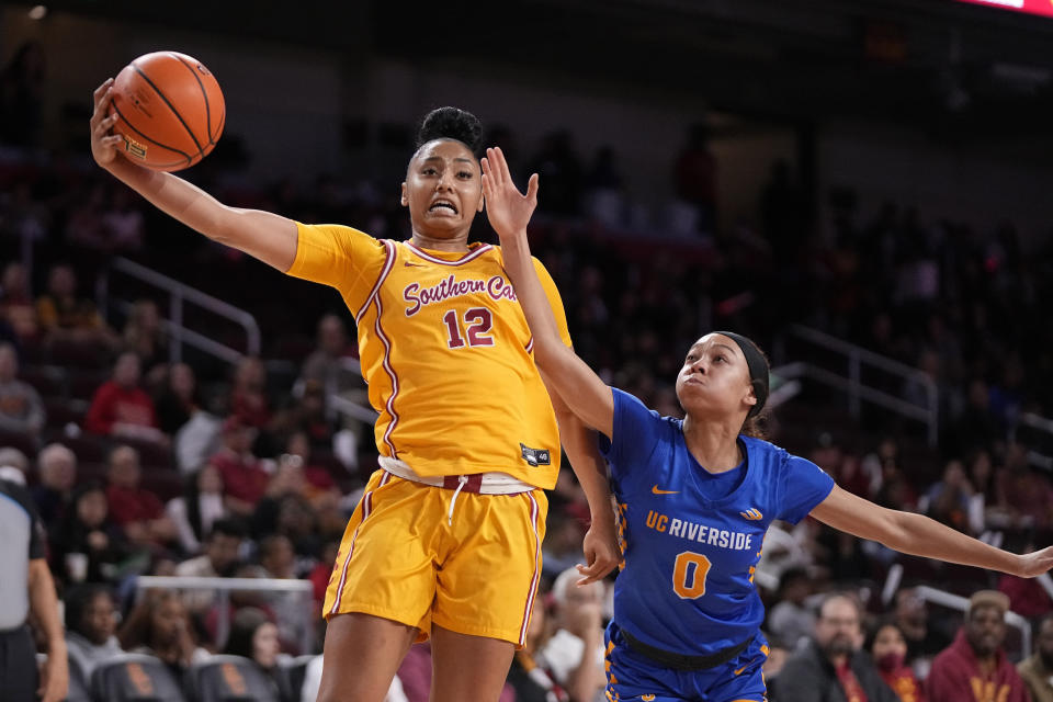 Southern California guard JuJu Watkins, left, shoots as UC Riverside guard Makayla Jackson defends during the first half of an NCAA college basketball game Sunday, Dec. 10, 2023, in Los Angeles. (AP Photo/Mark J. Terrill)
