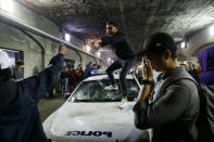 TORONTO, ON - JUNE 13: People stand on a Police cruiser as they celebrate a victory over the Golden State Warriors in game six of the NBA Finals on June 13, 2019 in Toronto, Canada. (Photo by Cole Burston/Getty Images)