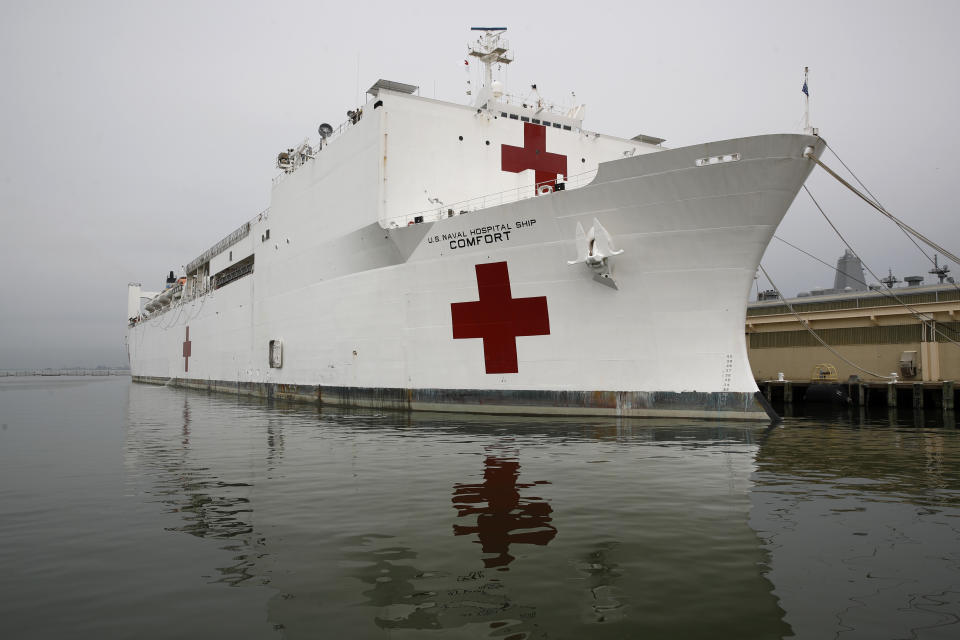 The U.S. Navy hospital ship USNS Comfort is docked at Naval Station Norfolk in Norfolk, Va., Saturday, March 28, 2020. The ship set to depart for New York to assist hospitals responding to the coronavirus outbreak. (AP Photo/Patrick Semansky)