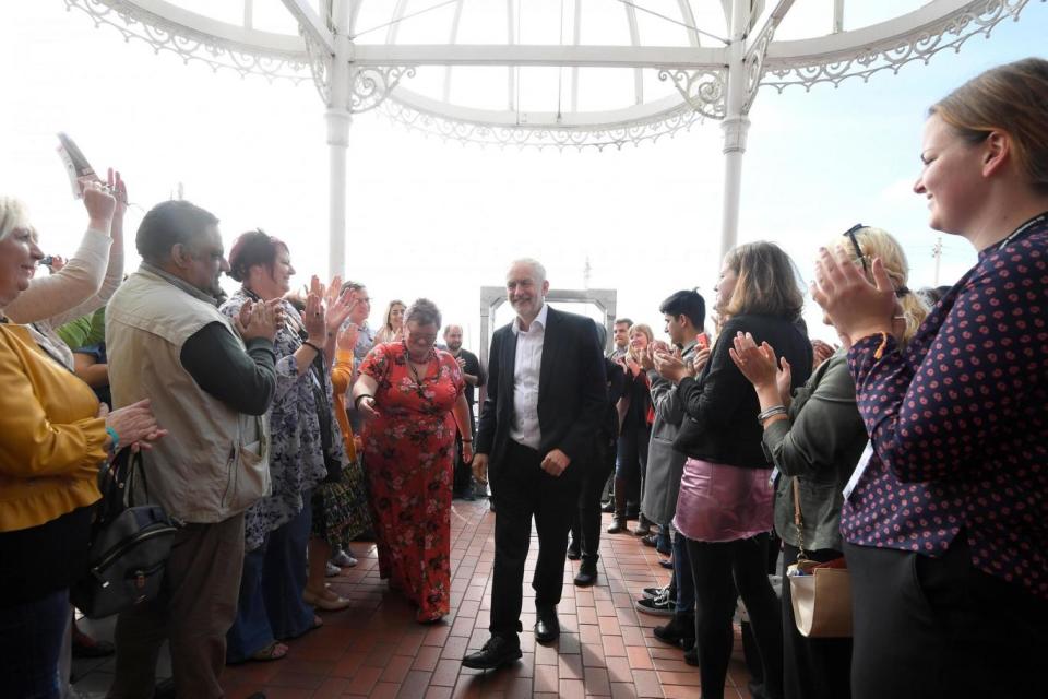 Mr Corbyn is greeted as he arrives at the Labour party Women's Conference in Brighton (REUTERS)