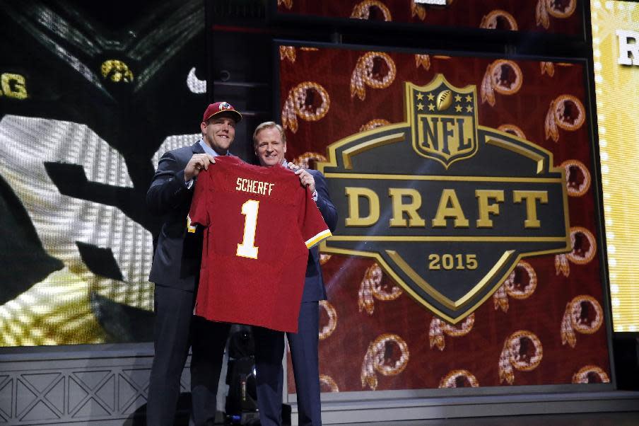 Iowa offensive lineman Brandon Scherff poses for photos with NFL commissioner Roger Goodell after being selected by the Washington Redskins as the fifth pick in the first round of the 2015 NFL Draft, Thursday, April 30, 2015, in Chicago. (AP Photo/Charles Rex Arbogast)