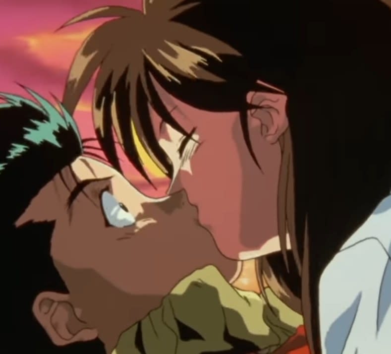 Keiko kissing an open eyed and shocked Yusuke