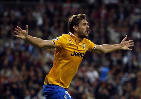 Juventus' Fernando Llorente celebrates after scoring a goal against Real Madrid during their Champions League soccer match at Santiago Bernabeu stadium in Madrid October 23, 2013. REUTERS/Paul Hanna