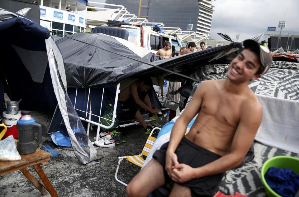 An Argentina fan relaxes at a tent and motorhome park amongst others waiting out for Sunday's World Cup final between Argentina and Germany at the Terreirao do Samba in Rio de Janeiro
