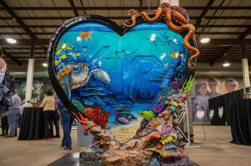 “Beneath the Waves” by artist Scott Seen is displayed Friday during the Parade of Hearts reveal kickoff event. Emily Curiel/ecuriel@kcstar.com
