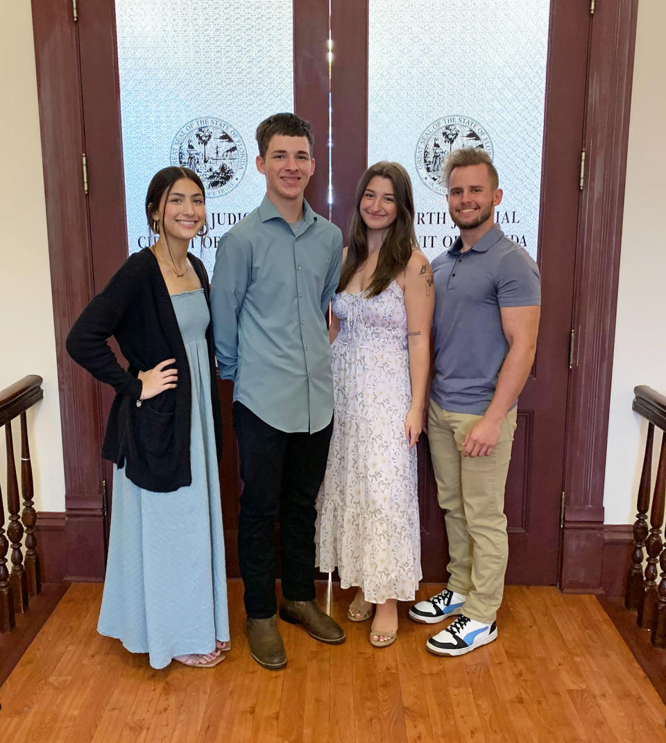 Roman Balassaitis posed with his siblings Tatiana, Halle and Austin on adoption day. (Courtesy Brad and Renee Balassaitis)
