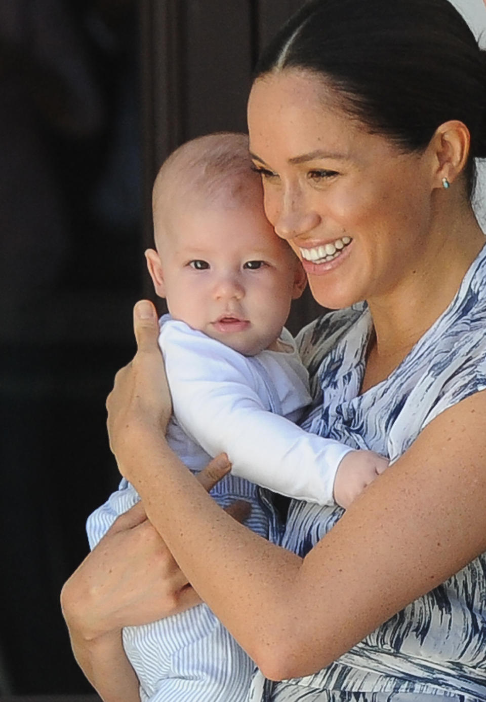 Britain's Duchess of Sussex Meghan, hold her baby son Archie as she and the husband meet with Archbishop Desmond Tutu and his wife Leah at the Tutu Legacy Foundation  in Cape Town on September 25, 2019. - The British royal couple are on  a 10-day tour of southern Africa -- their first official visit as a family since their son Archie was born in May. (Photo by HENK KRUGER / POOL / AFP)        (Photo credit should read HENK KRUGER/AFP/Getty Images)