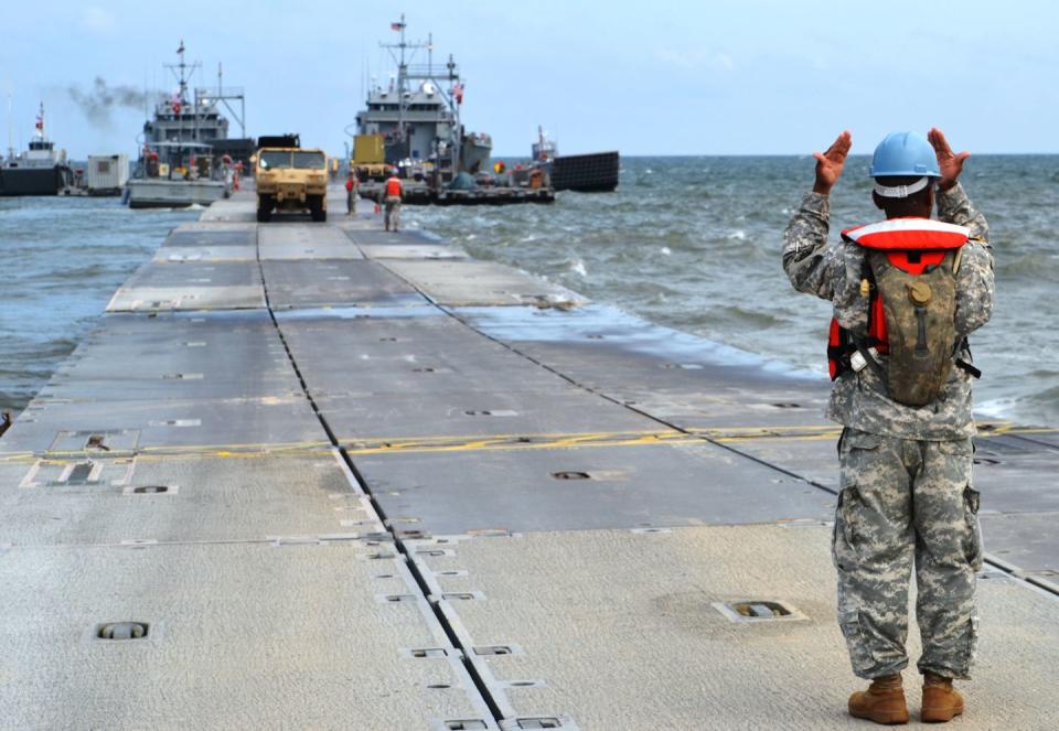 a man saluting on a ship