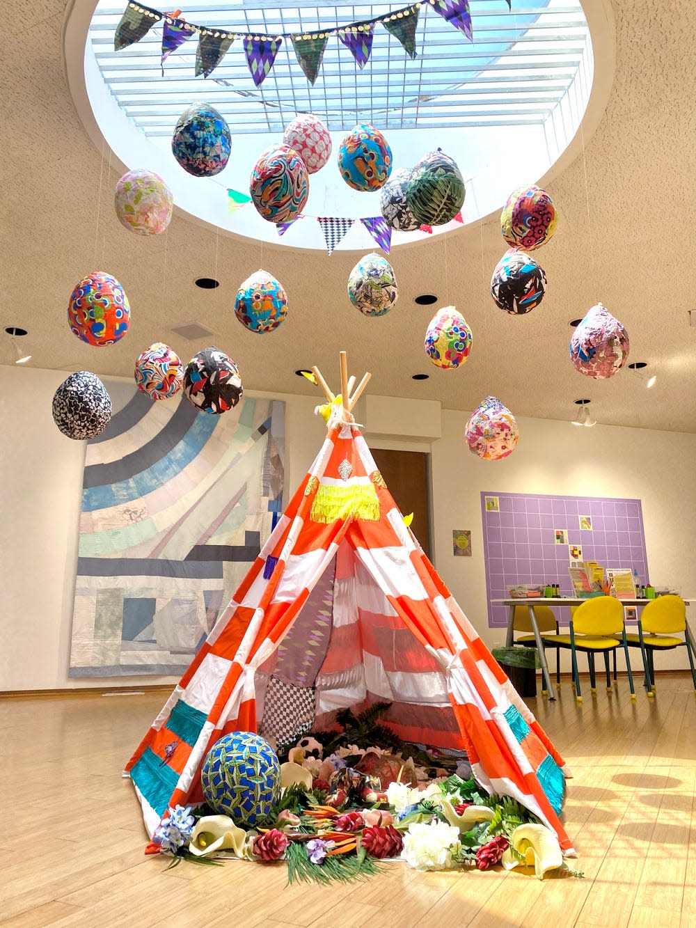 Ebony G. Patterson's piece "…just a baby…(…when they grow up…)" includes the handmade tent, fabric balloons and banner in the “moniquemeloche presents…" exhibit at the Lubeznik Center for the Arts in Michigan City.