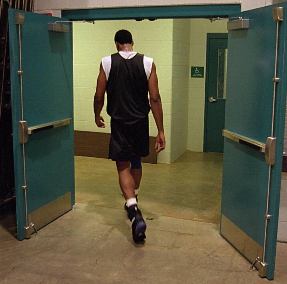 Alonzo Mourning slips away from practice at the Charlotte Hornets training facility on Thursday, Nov. 2, 1995, shortly before being traded.