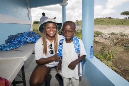 Tia Avril with one of the young students who will attend the new school (Avril Family Foundation)