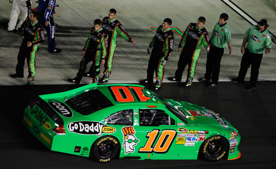 DAYTONA BEACH, FL - FEBRUARY 27: Danica Patrick, driver of the #10 GoDaddy.com Chevrolet, drives past her crew on the grid before the start of the NASCAR Sprint Cup Series Daytona 500 at Daytona International Speedway on February 27, 2012 in Daytona Beach, Florida. (Photo by Tom Pennington/Getty Images for NASCAR)