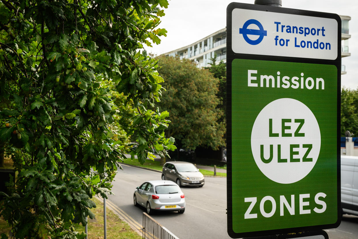 LONDON, ENGLAND - AUGUST 29: Vehicles pass by a sign indicating the new boundary of the LEZ and ULEZ expansion on August 29, 2023 in London, England. August 29 is the first day of the London-wide Ultra Low Emission Zone (ULEZ) expansion to all of Greater London, a policy designed to reduce air pollution by imposing charges on drivers of older, more polluting vehicles. The new rules have sparked political backlash in some parts of London and neighbouring counties. (Photo by Leon Neal/Getty Images)