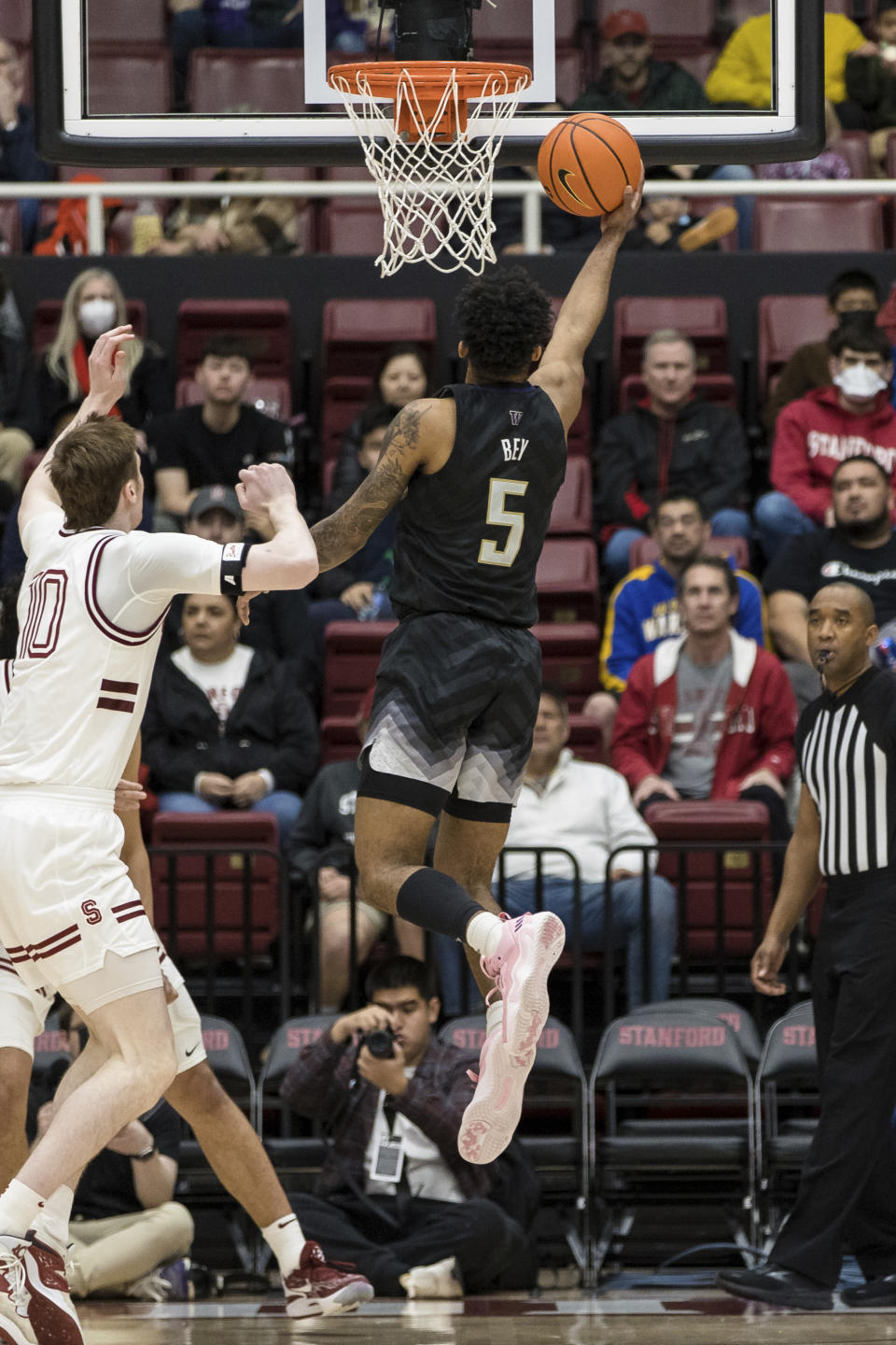 Washington guard Jamal Bey (5) shoots besides Stanford forward Max Murrell, left, during the first half of an NCAA college basketball game in Stanford, Calif., Sunday, Feb. 26, 2023. (AP Photo/John Hefti)